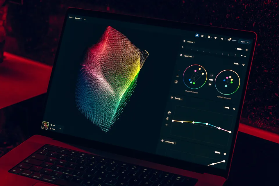 Close-up of a colorful data visualization displayed on a laptop screen in a dimly lit room.